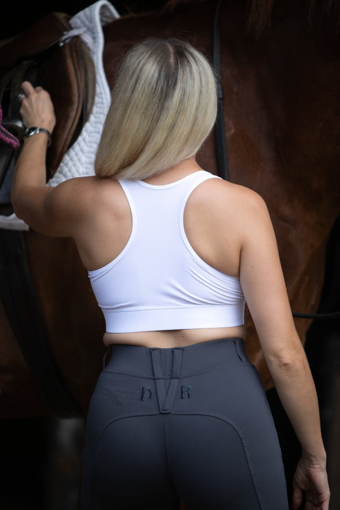 DVR Equestrian Keep It Together white competition bra racer back detail with graphite grey penny pull on jodhurs made from recycled plastic bottles
